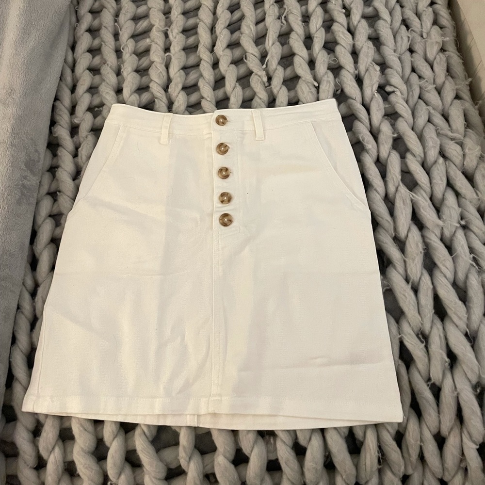white small button skirt